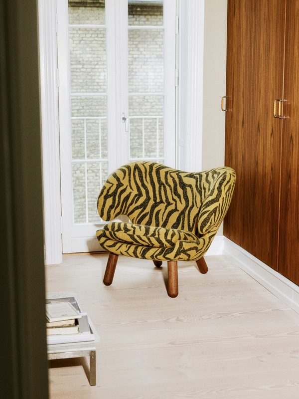 Pelican Chair with walnut legs and 'Sahco' upholstery in the color 'Tablu'. 