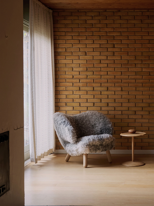 The Pelican Chair with legs in oak (clear oil) and upholstery in sheepskin from Gotland.