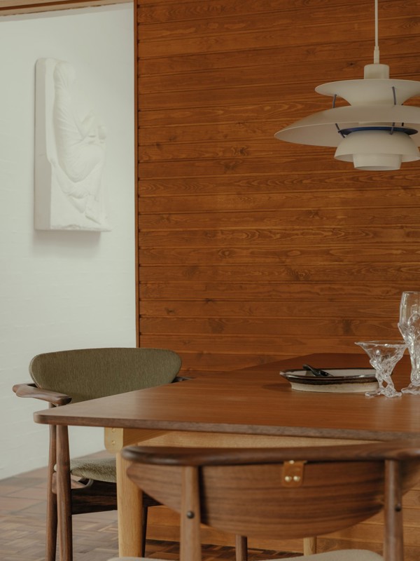 The Bovirke Table in walnut paired and oak (oiled) with the Reading Chair and 109 Chair in walnut.