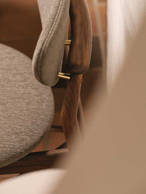 The 108 Chair in walnut with 'Beda' in the color '0170'.