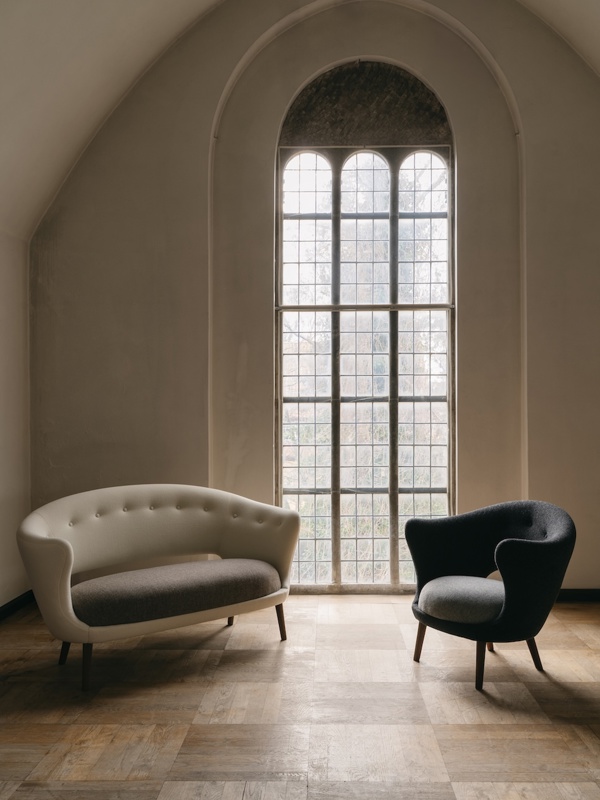 The Willadsen Sofa in walnut upholstered in Hallingdal textile in the color '100' on the backrest and '270' on the seat. The Willadsen Chair in walnut is also upholstered in Hallingdal textile in the color '180' on the backrest and '130' on the seat.