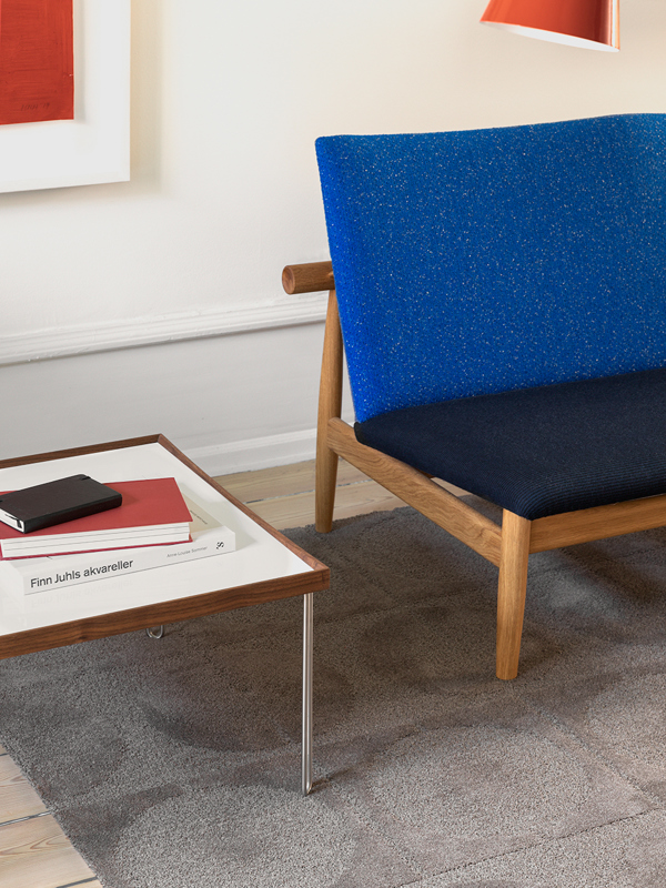 The Tray Table in walnut with white high gloss laminate tabletop.