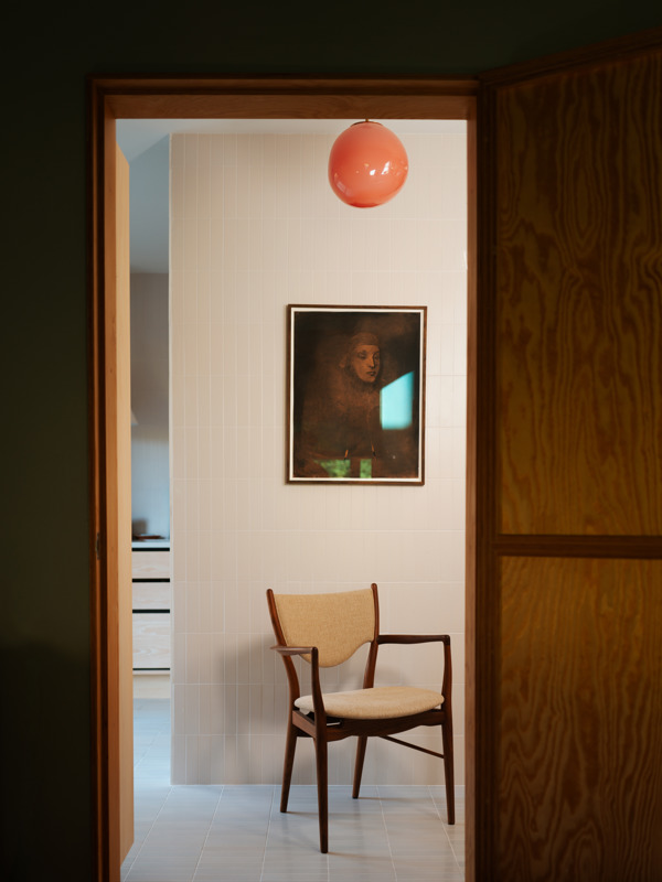 The 46 Armchair in walnut with 'Ecriture' upholstery in the colour ‘0240’.