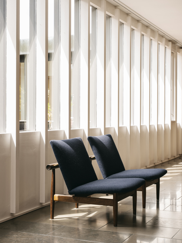 The Japan Chair in walnut with 'Blans' upholstery in the color '01-141'.