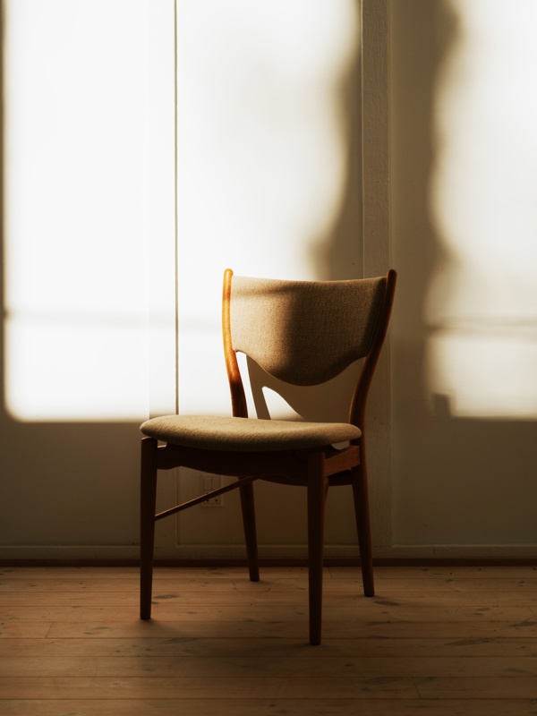 The 46 Chair in walnut with 'Ecriture' upholstery in the colour ‘0240’.