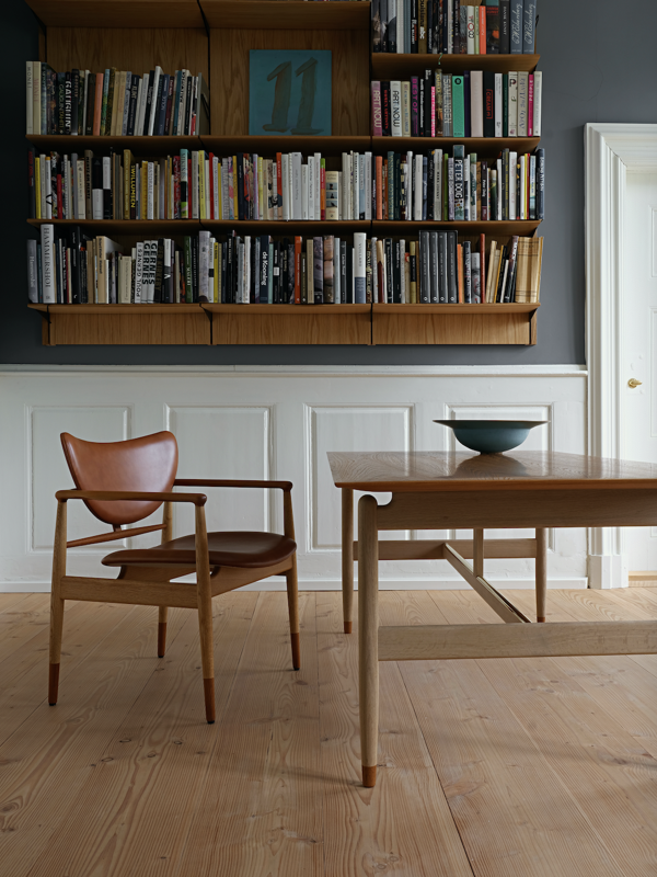 The 48 Chair in oak and walnut with 'Vegetal' leather upholstery in the colour '92'.