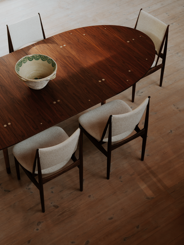 The Small Silver Table in walnut with sterling silver inlays, oak frame, and walnut feet, fully extended with two extension leaves.