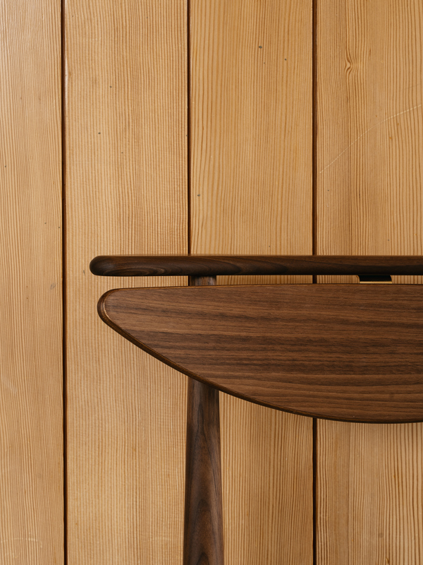Detail of the Reading Chair in walnut.
