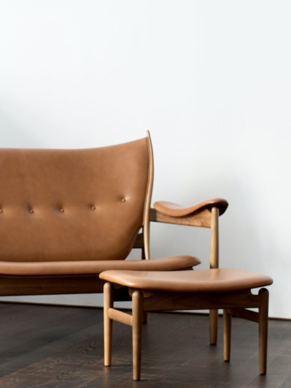 The Chieftain Footstool in walnut with 'Vegetal' upholstery in the colour '95'.