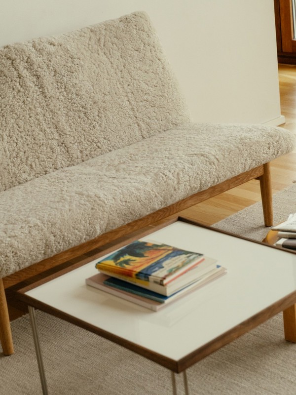 The Japan Sofa with oak frame and sheepskin upholstery in the color 'Moonlight'.