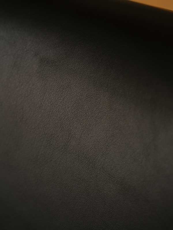 Aniline leather is a quality material whose original surface bears the unique marks of the animal's life story. Pictured here is 'Elegance' leather in the color 'Black'.