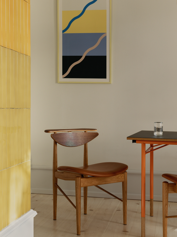 The Reading Chair in oak and walnut with 'Nevada' leather upholstery in the colour 'Cognac'.