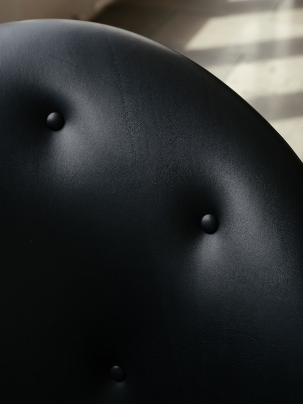 The Pelican Chair upholstered in black 'Elegance' leather.