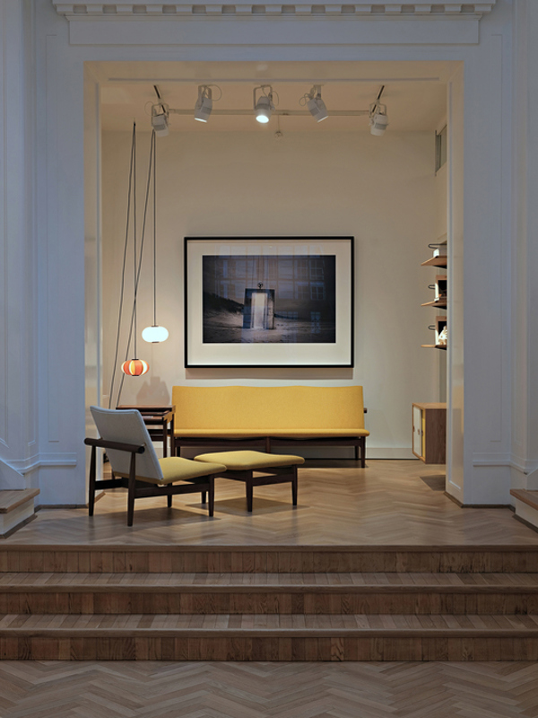 The Japan Footstool with walnut frame and 'Blans' upholstery in the colour '01-110'.