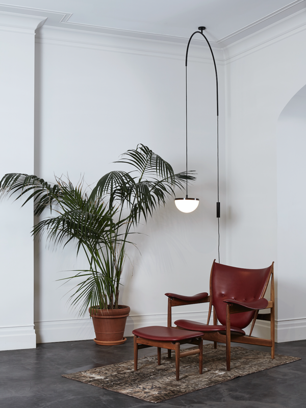  The Chieftain Footstool in walnut with 'Elegancel' upholstery in the colour 'Indian Red'.