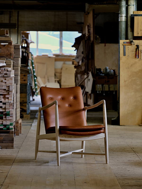 The Fireplace Chair photographed at our production facilities in Vejen, Denmark. The chair is crafted from FSC® certified ash (clear oil) and upholstered in VITA leather from Sørensen Leather.