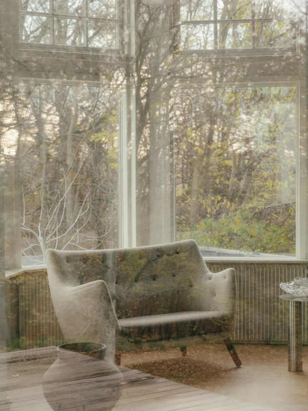 The Poet Sofa with walnut legs upholstered in Hallingdal textile in the color '200' on the backrest and '270' on the seat.